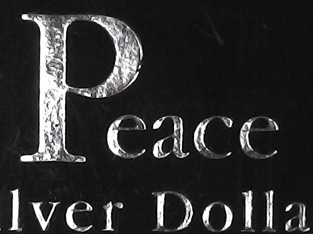 Metallic 'P' and 'peace' text on a black background with 'Silver Dollar' branding.