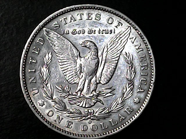 Silver Dollar with an eagle design and 'O' inscription on a black background