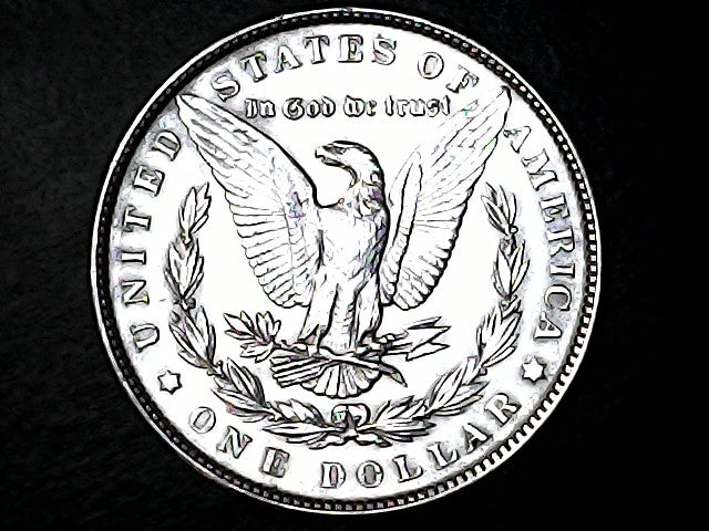 Silver Dollar with an eagle design and 'In God We Trust' inscription on a black background