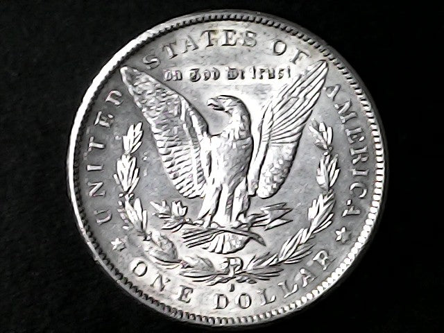 Silver Dollar with an eagle design, 'In God We Trust' and with "S" inscription on a black background
