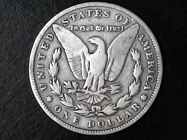Silver Dollar with an eagle design, 'In God We Trust' and with "S" inscription on a black background
