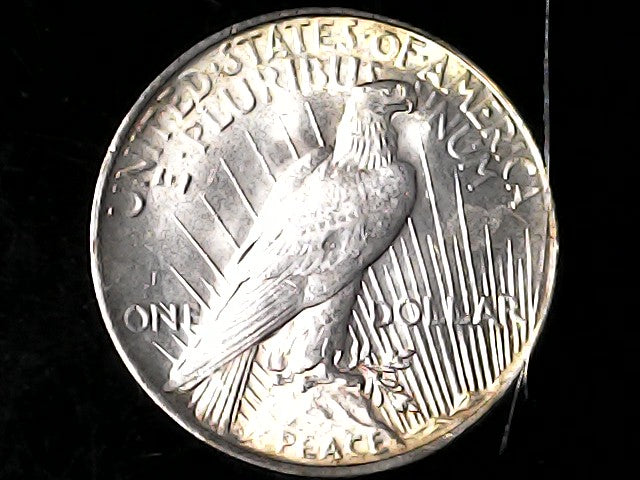 Silver Peace dollar coin with an eagle design ONE DOLLAR