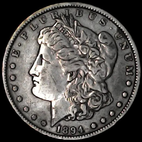 Silver Morgan Dollar Left-facing profile of Liberty wearing a Phrygian cap, with 'LIBERTY', "E PLURIBUS UNUM" and '1894' inscriptions