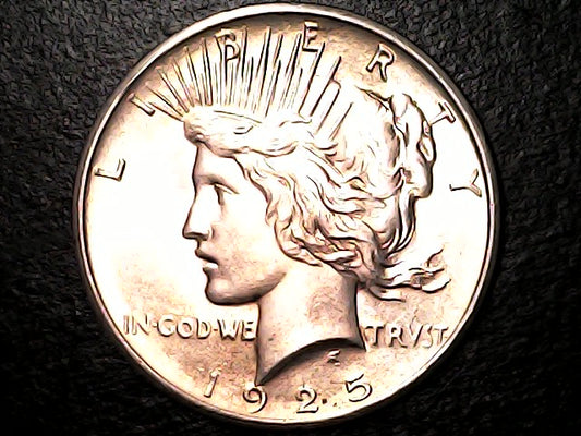 1925 Silver Peace dollar with 'Liberty' and 'In God We Trust' inscriptions
