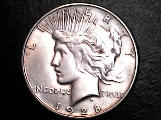 1928 silver Peace dollar with 'Liberty' and 'In God We Trust' inscriptions