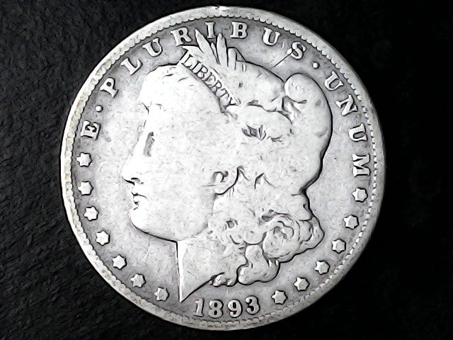 Silver Morgan Dollar Left-facing profile of Liberty wearing a Phrygian cap, with 'LIBERTY', "E PLURIBUS UNUM" and '1893' inscriptions on a black background with case