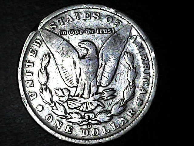 Silver Dollar with an eagle design with "O" inscription on a black background