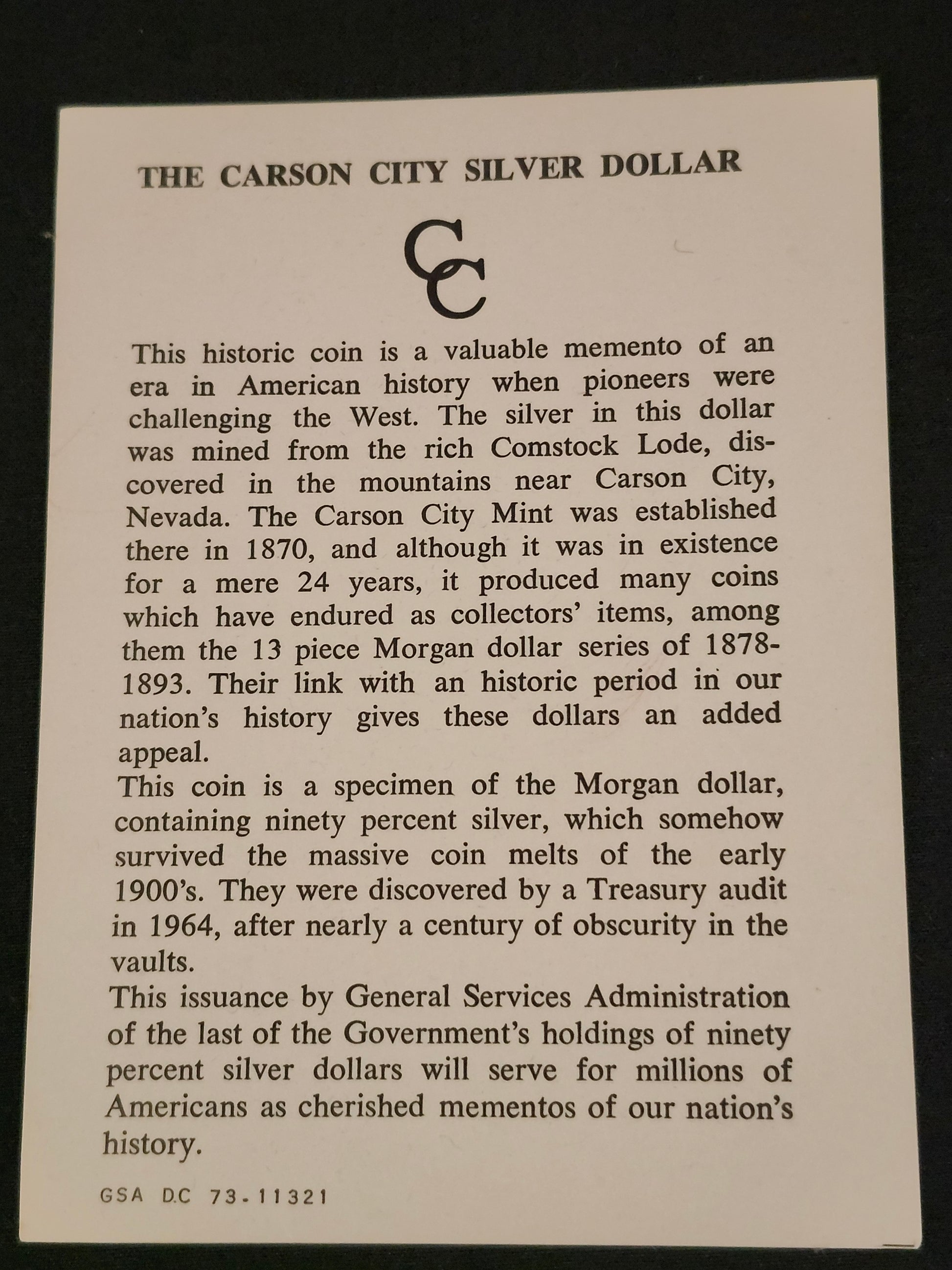 Card with text about the Carson City Silver Dollar on a black background
