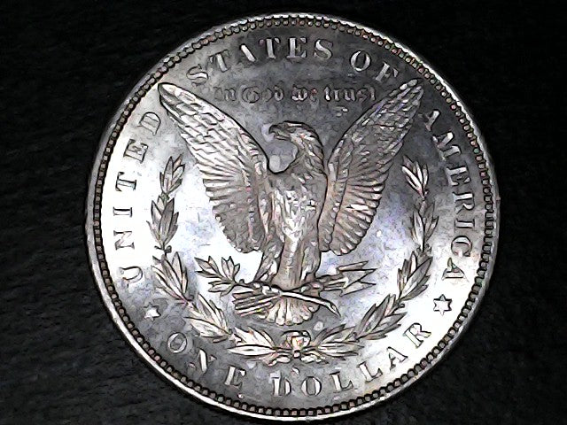 Silver Dollar with an eagle design, 'In God We Trust' and with "S" inscription on a black background