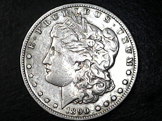 Silver Morgan Dollar Left-facing profile of Liberty wearing a Phrygian cap, with 'LIBERTY', "E PLURIBUS UNUM" and '1890' inscriptions on a black background with case