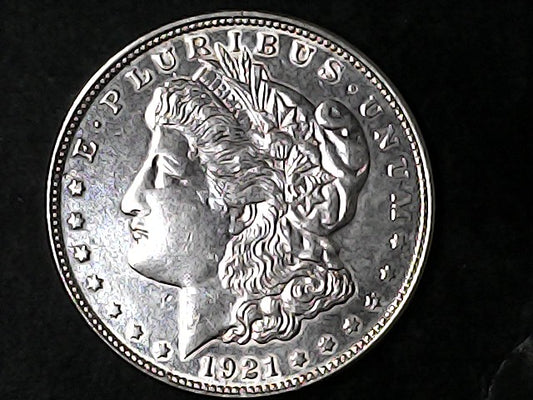 Silver Morgan Dollar Left-facing profile of Liberty wearing a Phrygian cap, with 'LIBERTY', "E PLURIBUS UNUM" and '1921' inscriptions on a black background with case