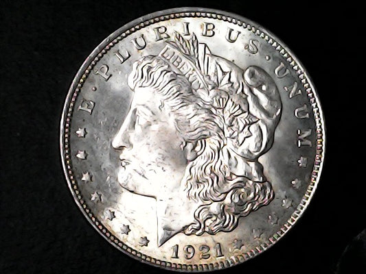 Silver Morgan Dollar Left-facing profile of Liberty wearing a Phrygian cap, with 'LIBERTY', "E PLURIBUS UNUM" and '1921' inscriptions on a black background with case