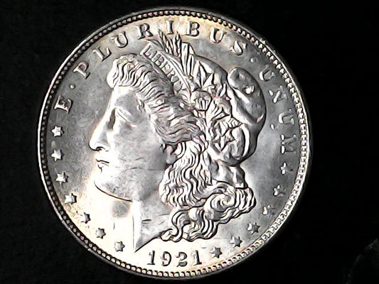 Silver Morgan Dollar Left-facing profile of Liberty wearing a Phrygian cap, with 'LIBERTY', "E PLURIBUS UNUM" and '1921' inscriptions on a black background with case