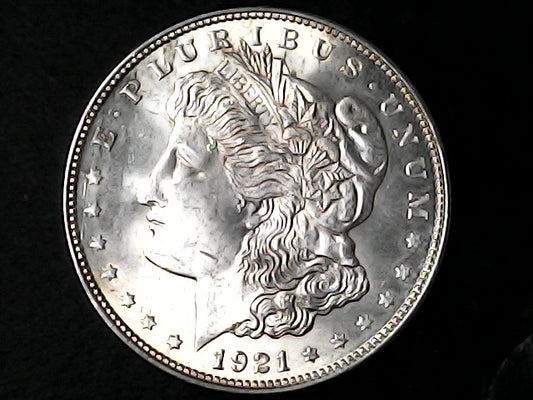 Silver Morgan Dollar Left-facing profile of Liberty wearing a Phrygian cap, with 'LIBERTY', "E PLURIBUS UNUM" and '1921' inscriptions on a black background with case