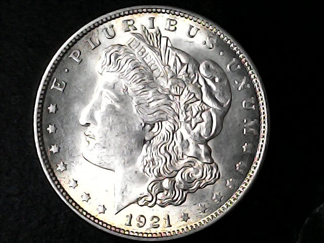 Silver Morgan Dollar Left-facing profile of Liberty wearing a Phrygian cap, with 'LIBERTY', "E PLURIBUS UNUM" and '1921' inscriptions on a black background with case