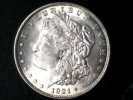 Silver Morgan Dollar Left-facing profile of Liberty wearing a Phrygian cap, with 'LIBERTY', "E PLURIBUS UNUM" and '1921' inscriptions on a black background with case