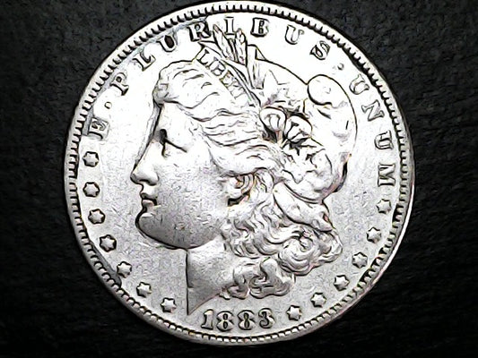 Silver Morgan Dollar Left-facing profile of Liberty wearing a Phrygian cap, with 'LIBERTY', "E PLURIBUS UNUM" and '1883' inscriptions on a black background with case