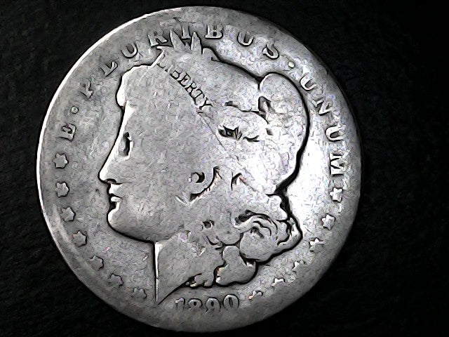 Silver Morgan Dollar with 'E Pluribus Unum', 'Liberty'  and '1890' inscriptions on a black background with case