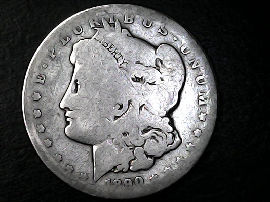 Silver Morgan Dollar with 'E Pluribus Unum', 'Liberty'  and '1890' inscriptions on a black background with case