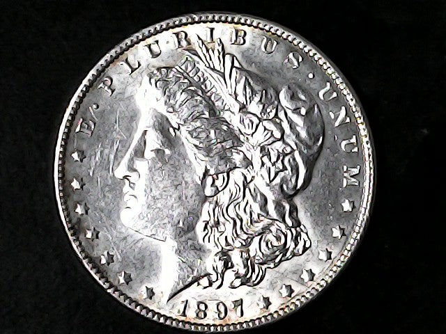 Silver Morgan Dollar Left-facing profile of Liberty wearing a Phrygian cap, with 'LIBERTY', "E PLURIBUS UNUM" and '1897' inscriptions on a black background with case
