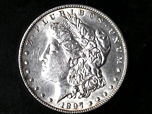 Silver Morgan Dollar Left-facing profile of Liberty wearing a Phrygian cap, with 'LIBERTY', "E PLURIBUS UNUM" and '1897' inscriptions on a black background with case