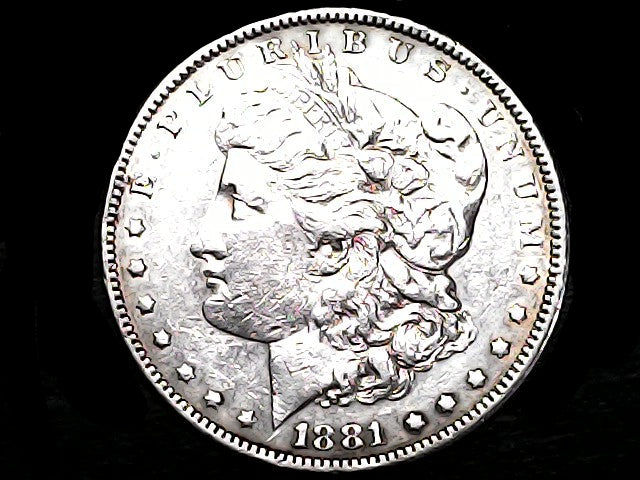 Silver Morgan Dollar Left-facing profile of Liberty wearing a Phrygian cap, with 'LIBERTY', "E PLURIBUS UNUM" and '1881' inscriptions on a black background with case