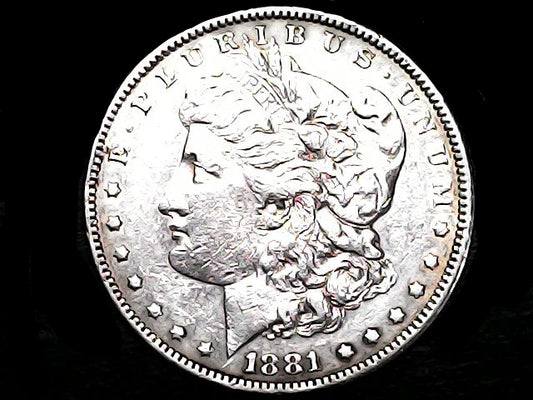 Silver Morgan Dollar Left-facing profile of Liberty wearing a Phrygian cap, with 'LIBERTY', "E PLURIBUS UNUM" and '1881' inscriptions on a black background with case