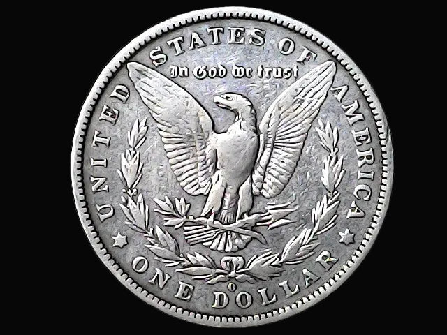 Silver Morgan dollar coin with an eagle and 'O' inscription design on a black background