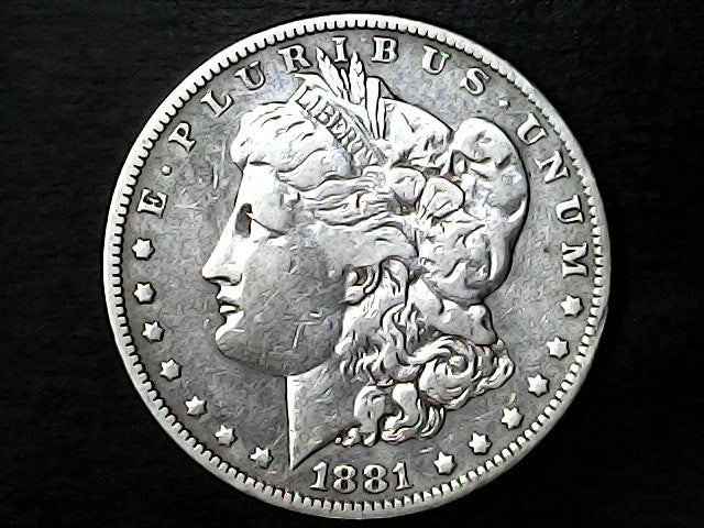 '1881' Silver Morgan dollar coin with 'Liberty' on a black background