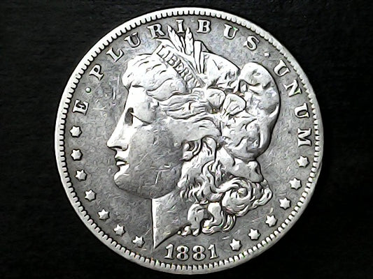 '1881' Silver Morgan dollar coin with 'Liberty' on a black background