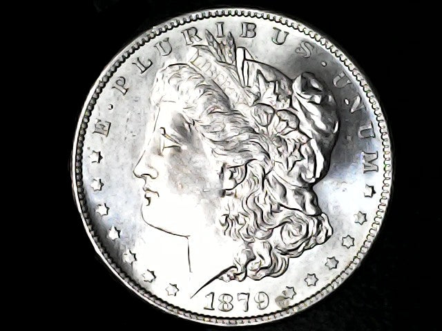 Silver Morgan Dollar Left-facing profile of Liberty wearing a Phrygian cap, with 'LIBERTY', "E PLURIBUS UNUM" and '1879' inscriptions on a black background with case