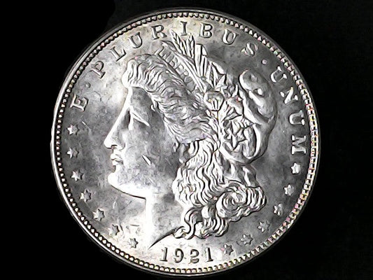 Silver Morgan Dollar Left-facing profile of Liberty wearing a Phrygian cap, with 'LIBERTY', "E PLURIBUS UNUM" and '1921' inscriptions on a black background with case