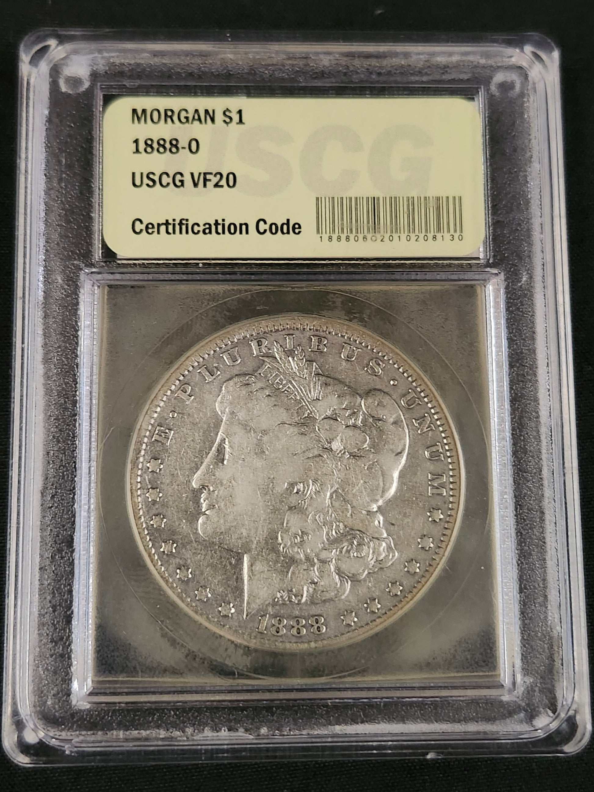 1888-O Certified USCG VF-20 Morgan Silver Dollar in a protective case with grading information