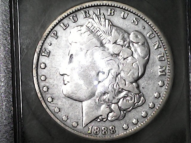 1888-O Certified Morgan Silver Dollar with 'E Pluribus Unum' '1888' inscription 'Hot Lips' on a dark background