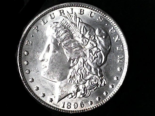 Silver Morgan Dollar Left-facing profile of Liberty wearing a Phrygian cap, with 'LIBERTY', "E PLURIBUS UNUM" and '1896' inscriptions on a black background with case