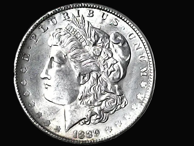 Silver Morgan Dollar with 'E Pluribus Unum', 'Liberty'  and '1889' inscriptions on a black background