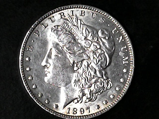 Silver Morgan Dollar Left-facing profile of Liberty wearing a Phrygian cap, with 'LIBERTY', "E PLURIBUS UNUM" and '1897' inscriptions on a black background with case
