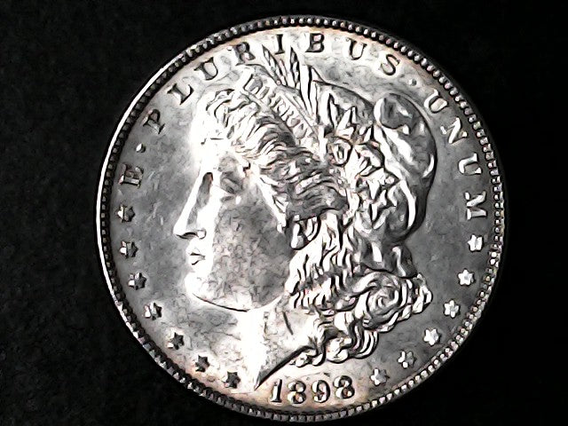 Silver Morgan Dollar Left-facing profile of Liberty wearing a Phrygian cap, with 'LIBERTY', "E PLURIBUS UNUM" and '1898' inscriptions on a black background with case