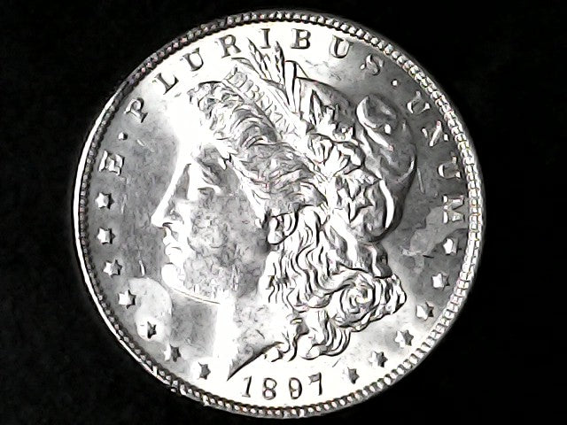 Silver Morgan Dollar Left-facing profile of Liberty wearing a Phrygian cap, with 'LIBERTY', "E PLURIBUS UNUM" and '1897' inscriptions on a black background with case