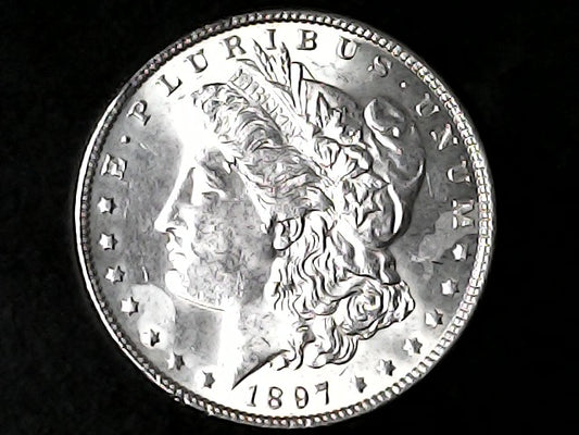 Silver Morgan Dollar Left-facing profile of Liberty wearing a Phrygian cap, with 'LIBERTY', "E PLURIBUS UNUM" and '1897' inscriptions on a black background with case