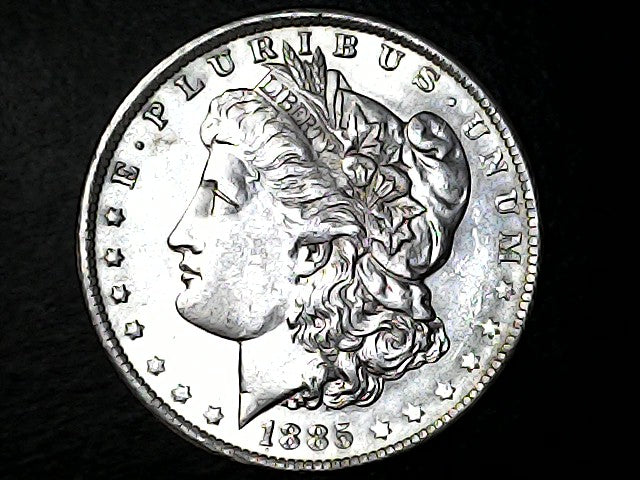Silver Morgan Dollar coin with a dark background
