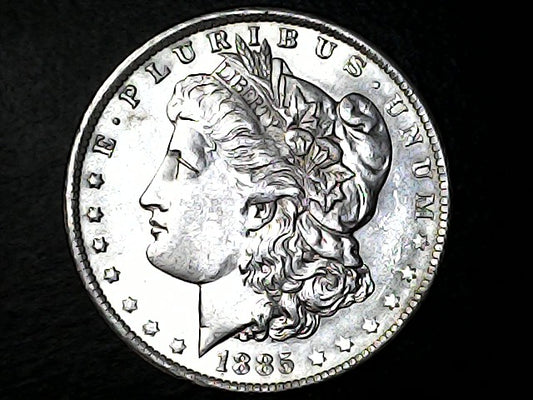 Silver Morgan Dollar coin with a dark background