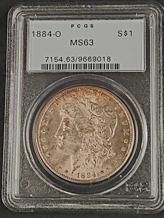 Morgan silver dollar coin in a protective holder with PCGS grading label