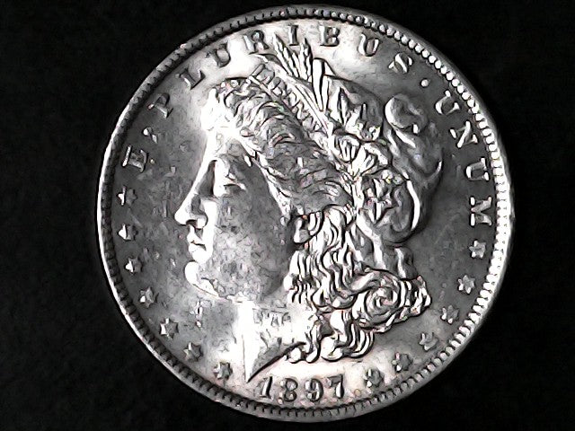 Silver Morgan Dollar Left-facing profile of Liberty wearing a Phrygian cap, with 'LIBERTY', "E PLURIBUS UNUM" and '1897' inscriptions on a black background with case