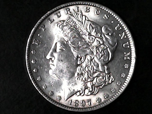 Silver Morgan Dollar Left-facing profile of Liberty wearing a Phrygian cap, with 'LIBERTY', "E PLURIBUS UNUM" and '1897' inscriptions on a black background with case