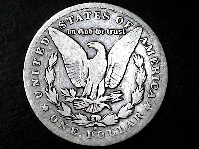 Silver Dollar with an eagle design and 'S' inscription on a black background 