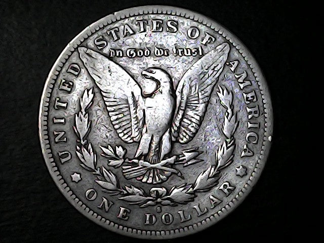 Silver Dollar with eagle design and 'S' inscription on a dark background