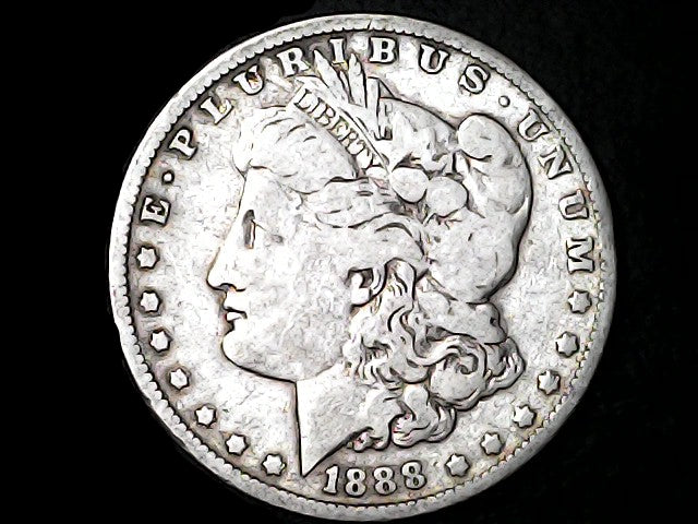 Silver Morgan dollar coin with 'E Pluribus Unum', 'Liberty' and '1888' inscriptions on a dark background