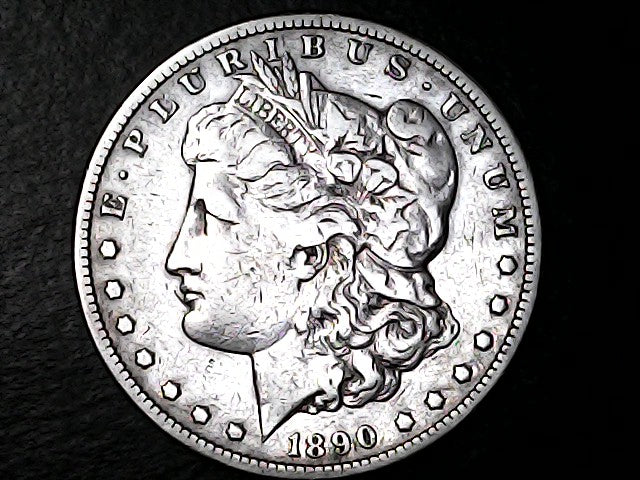 Silver Morgan Dollar with 'E Pluribus Unum', 'Liberty'  and '1890' inscriptions on a black background