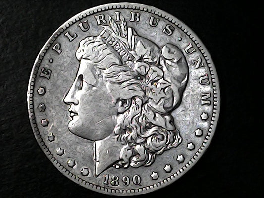 Silver Morgan Dollar Left-facing profile of Liberty wearing a Phrygian cap, with 'LIBERTY', "E PLURIBUS UNUM" and '1890' inscriptions on a black background with case